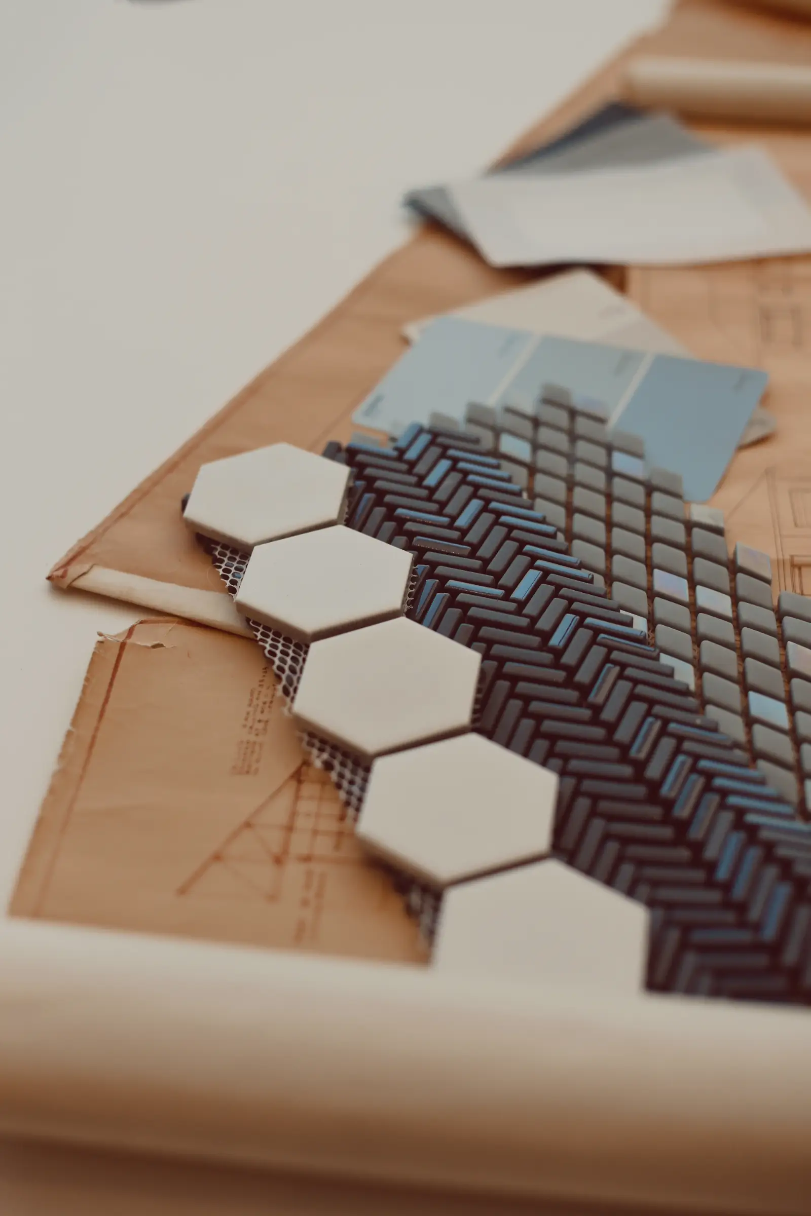 A detail photo of material swatches laying on a table together with a floor plan.